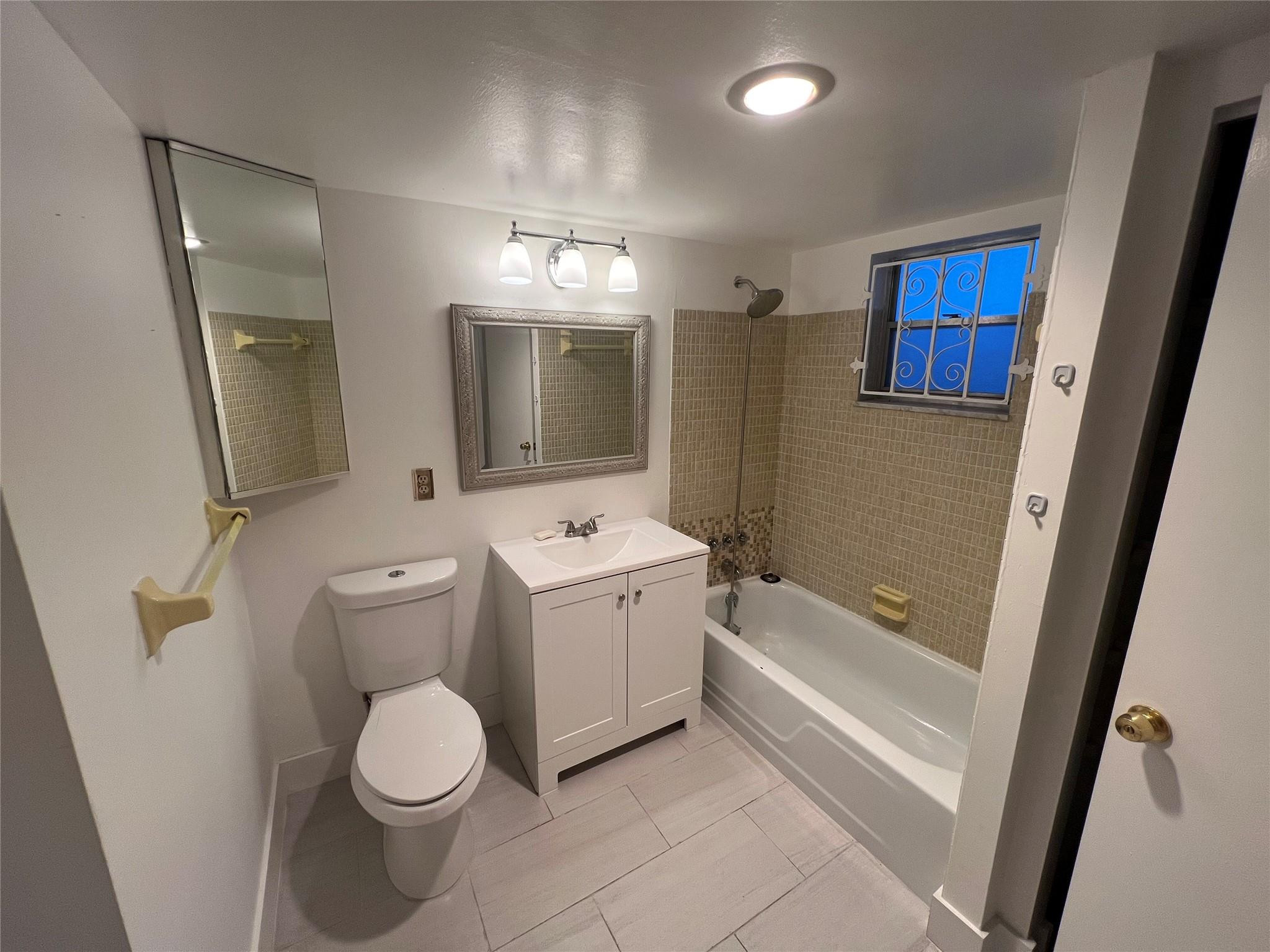 Undisclosed Address Dania Beach, FL 33004 - Photo 6 of 8 a bathroom with a toilet sink and mirror or bathtub