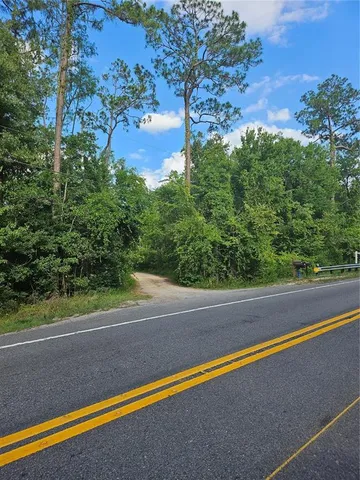 a view of a field with an outdoor space
