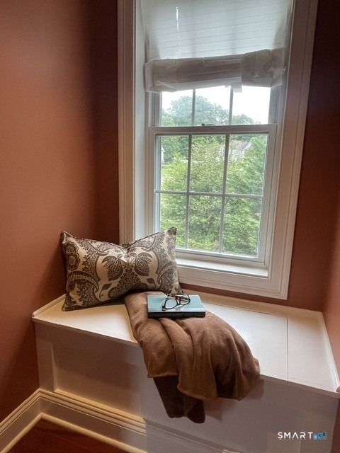 4 Ortense Road Wallingford, CT 06492 - Photo 30 of 33 a bed sitting in a bedroom next to a window