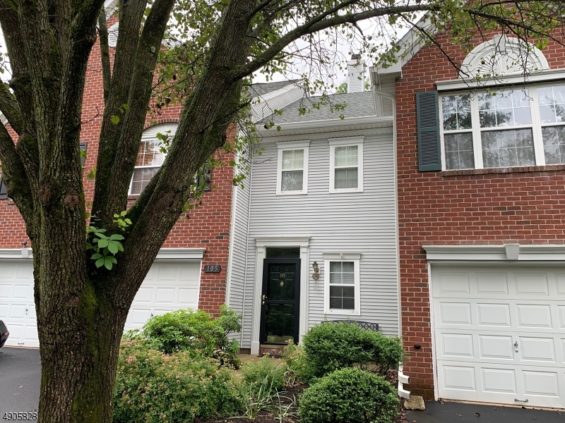 105 Well Sweep Road, Unit 105 Whitehouse Station, NJ 08889 - Photo 19 of 22 a front view of a house with a tree