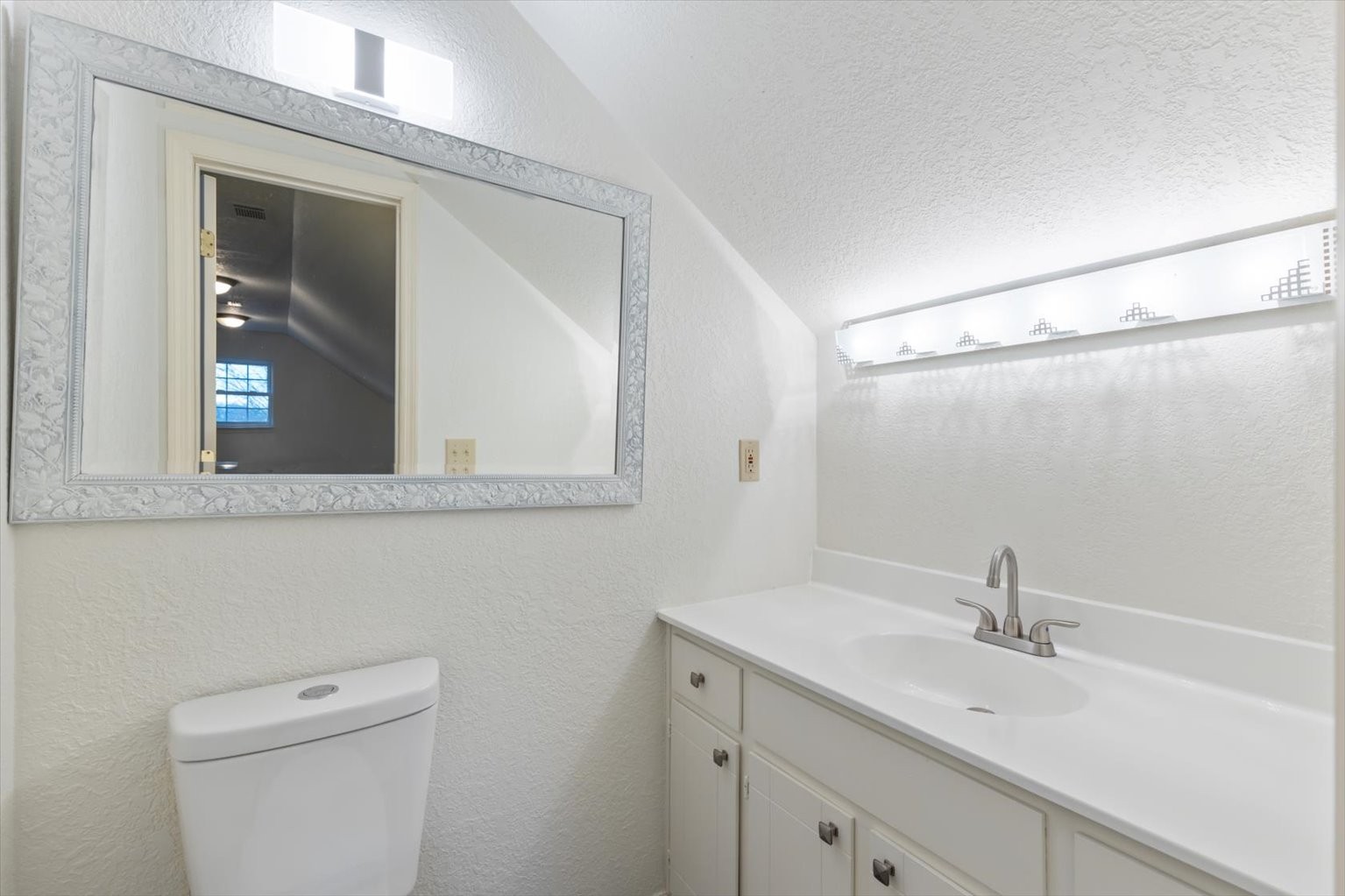 1775 Nelson Road Goodlettsville, TN 37072 - Photo 30 of 45 a bathroom with a granite countertop sink a toilet and a mirror