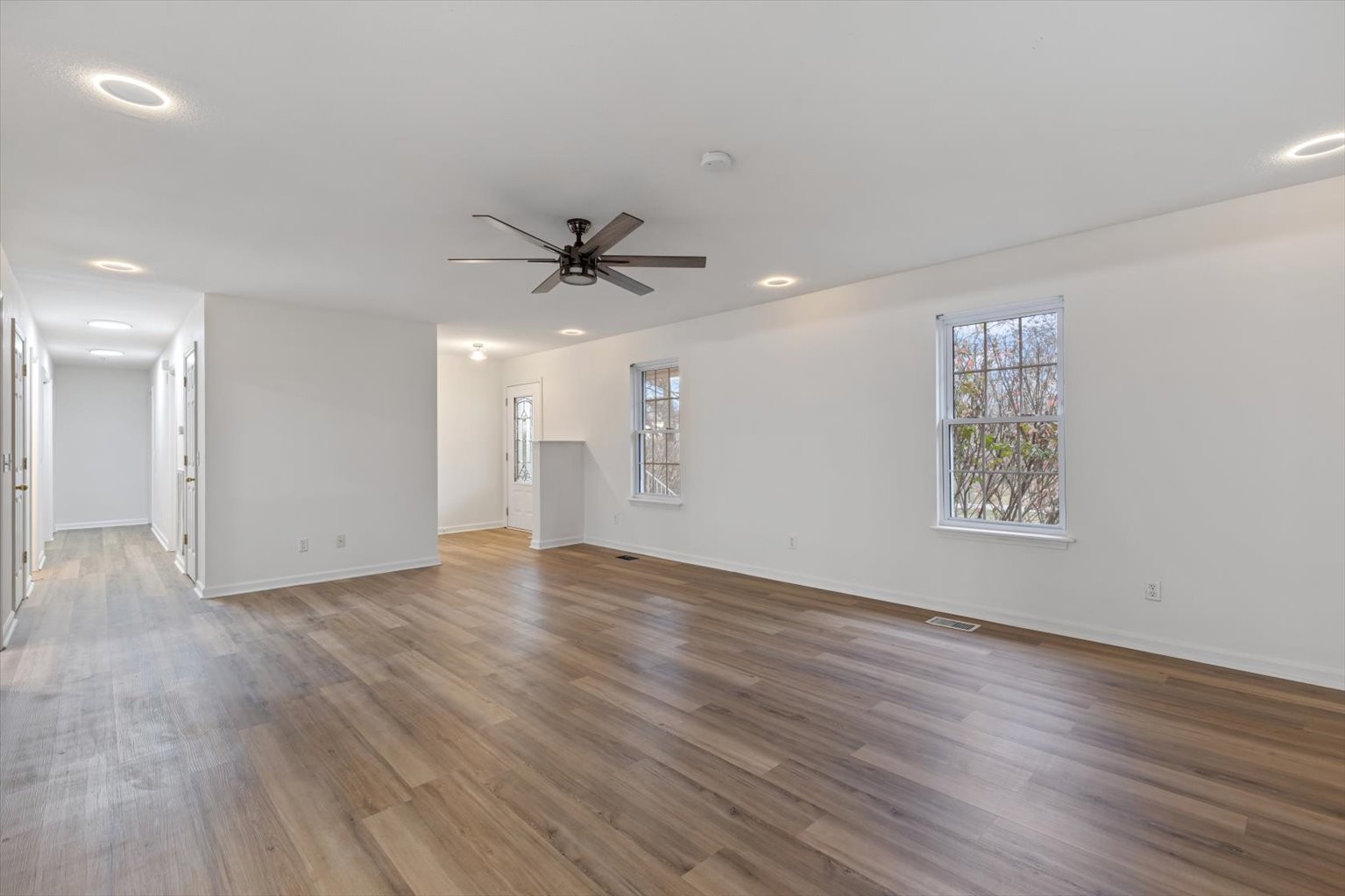 1775 Nelson Road Goodlettsville, TN 37072 - Photo 6 of 45 a view of an empty room with a window and wooden floor