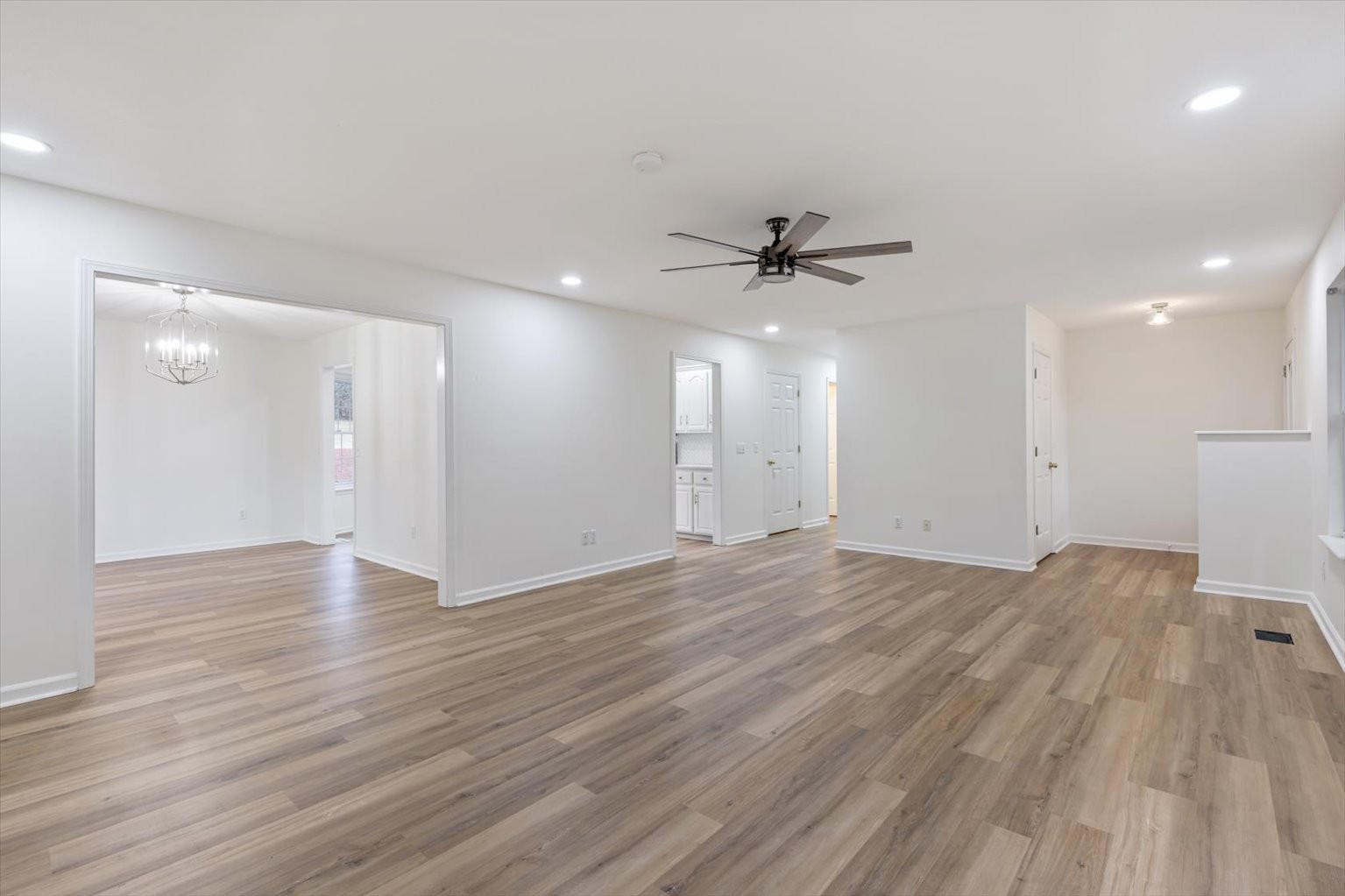 1775 Nelson Road Goodlettsville, TN 37072 - Photo 7 of 45 a view of an empty room with a window and wooden floor