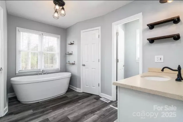 a bathroom with a bathtub and shower
