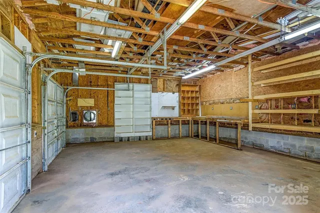 a view of an empty room with wooden walls