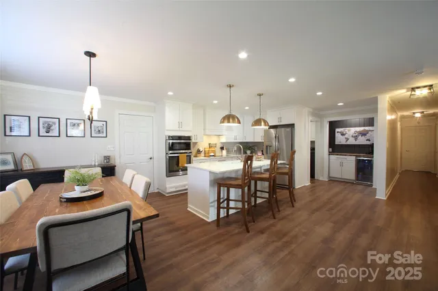 a view of kitchen with cabinets and wooden floor