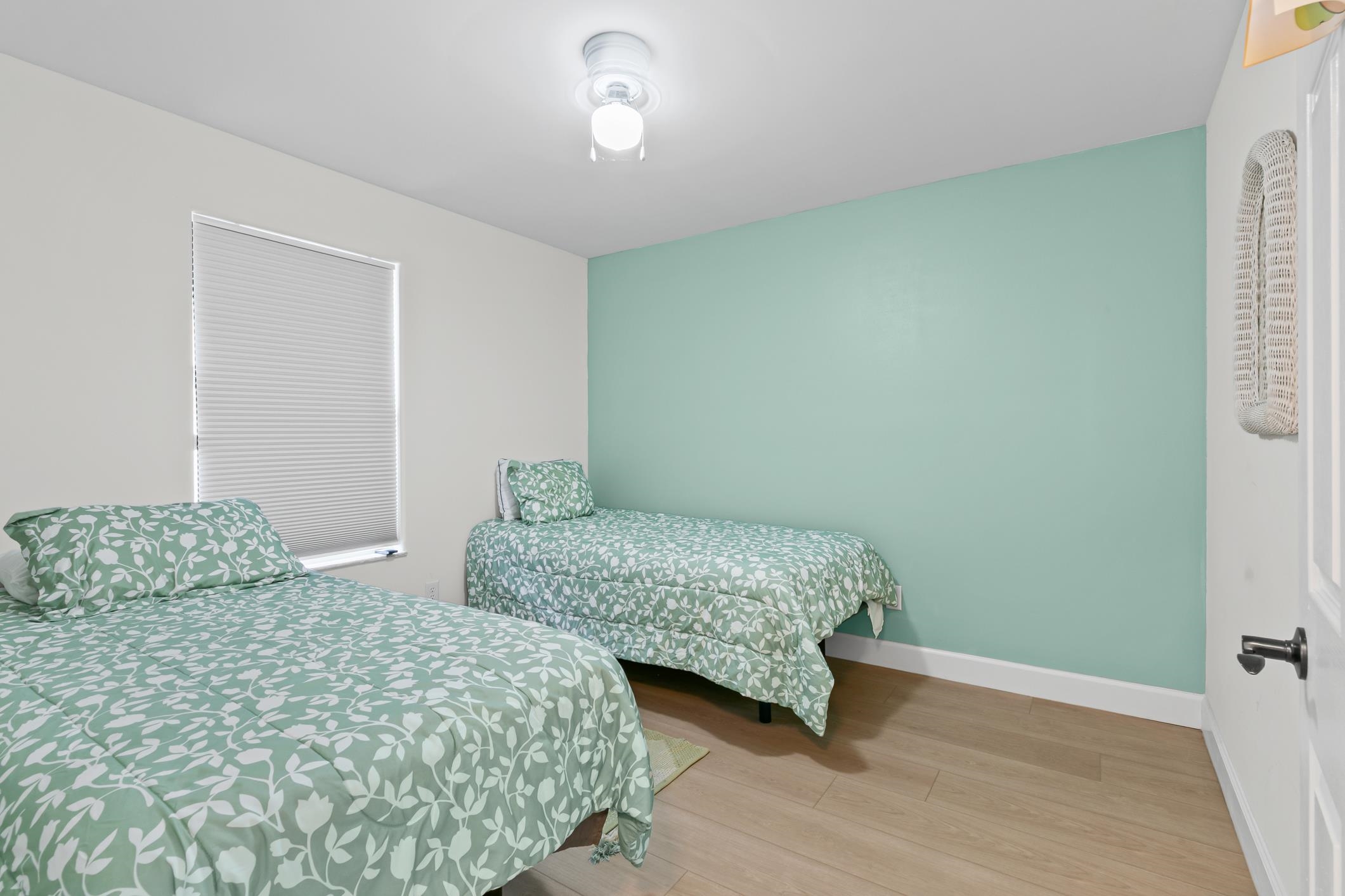 11511 Mandarin Road Jacksonville, FL 32223 - Photo 13 of 41 a bedroom with two beds and wooden floor