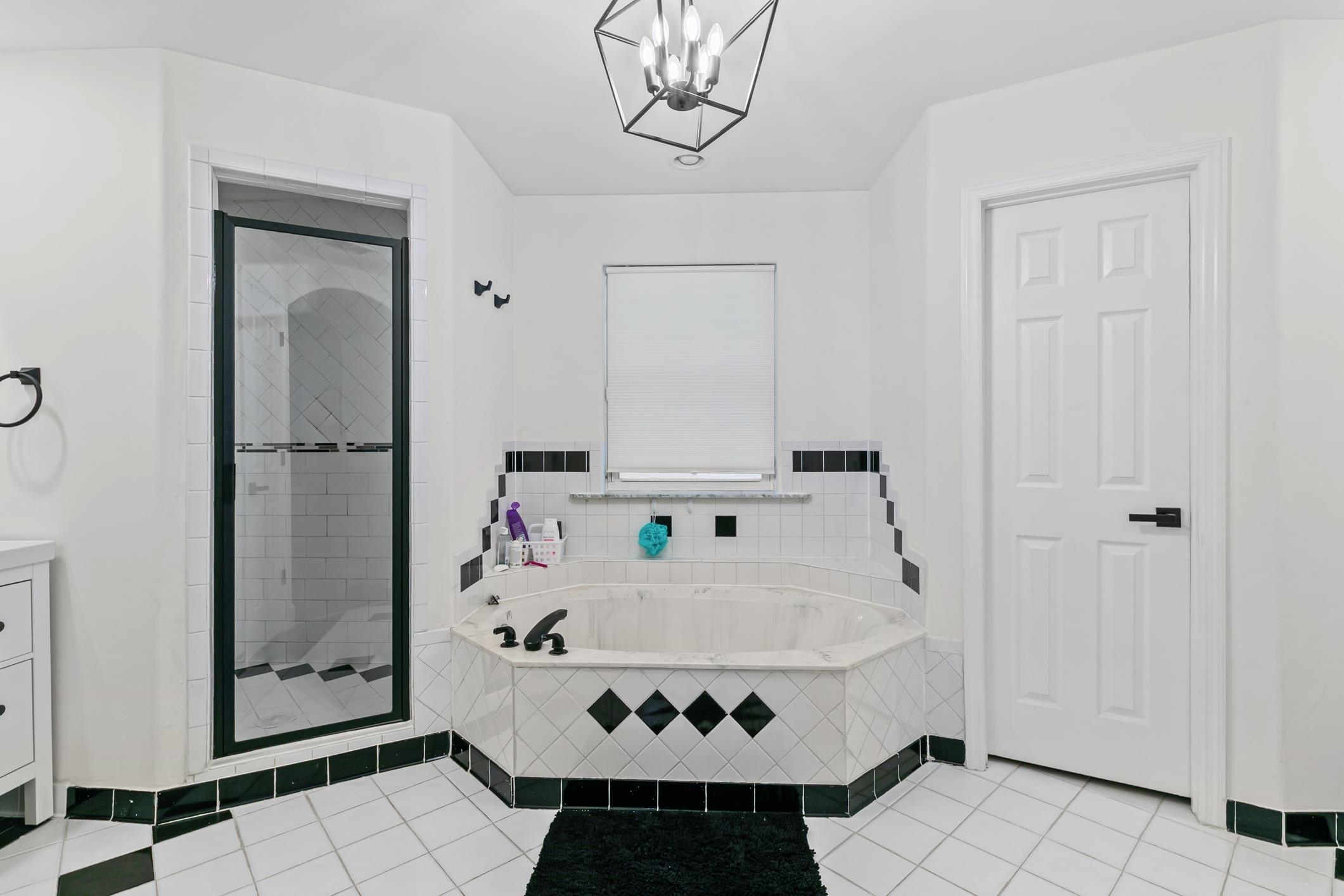 11511 Mandarin Road Jacksonville, FL 32223 - Photo 22 of 41 a bathroom with a tub and a shower