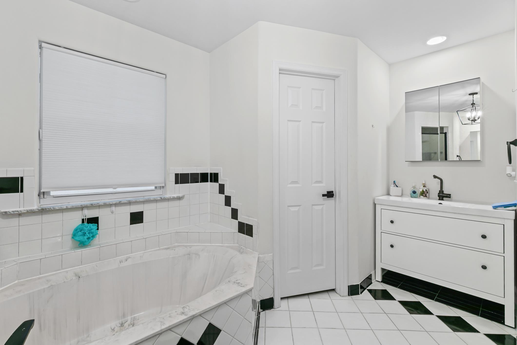 11511 Mandarin Road Jacksonville, FL 32223 - Photo 23 of 41 Full bathroom with vanity, a garden tub, light tile patterned flooring, and recessed lighting
