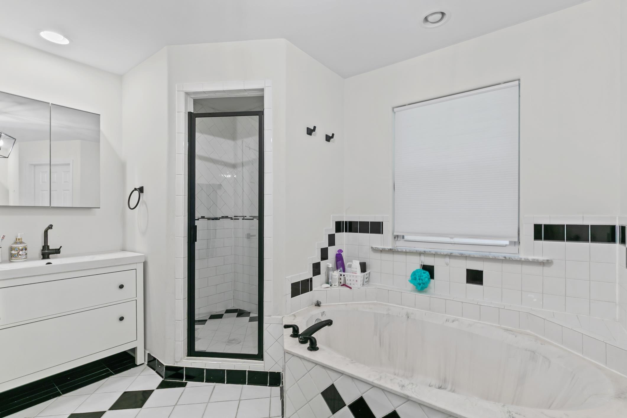 11511 Mandarin Road Jacksonville, FL 32223 - Photo 24 of 41 a bathroom with a bathtub sink and mirror