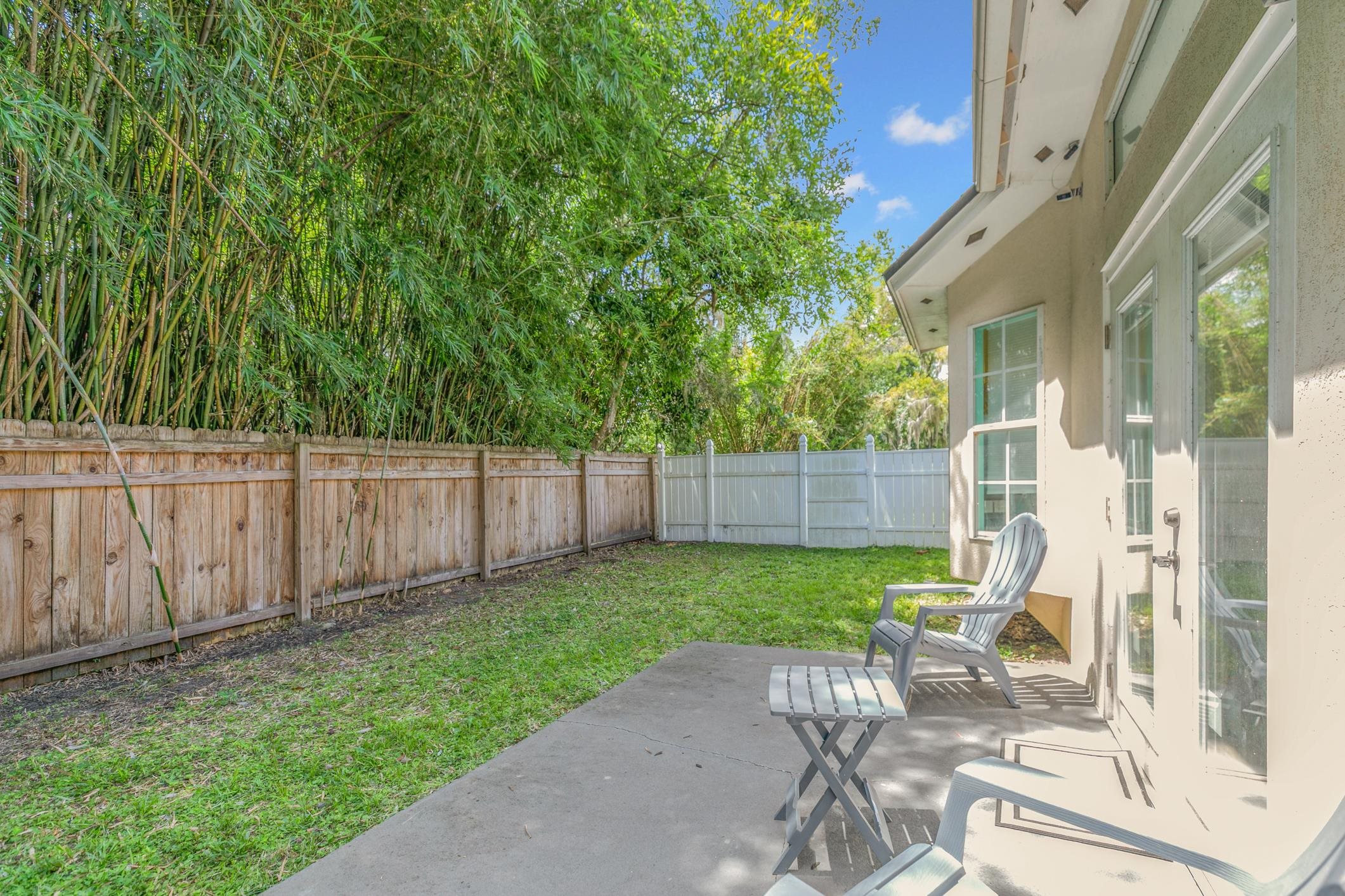 11511 Mandarin Road Jacksonville, FL 32223 - Photo 33 of 41 Fenced backyard with a patio area
