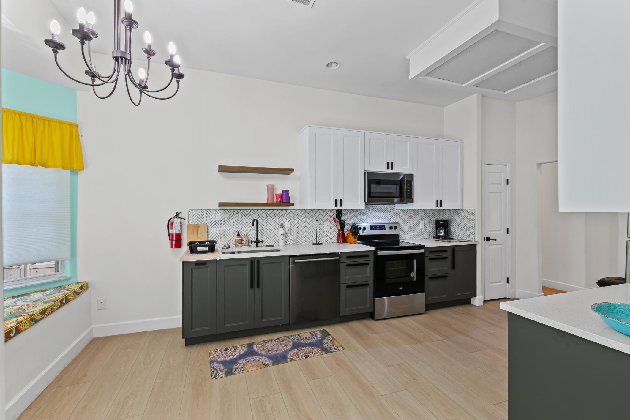 11511 Mandarin Road Jacksonville, FL 32223 - Photo 8 of 41 Kitchen featuring white cabinetry, appliances with stainless steel finishes, open shelves, light wood-style flooring, and decorative backsplash