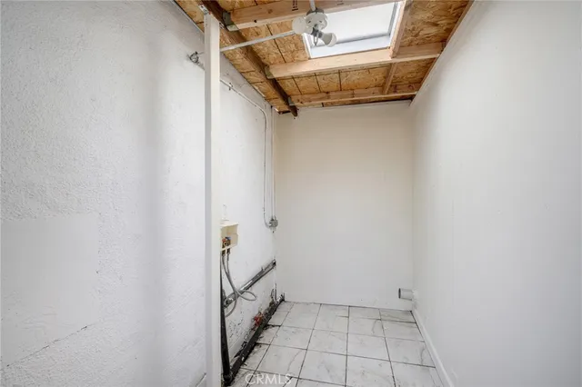 a bathroom with a glass door shower and sink