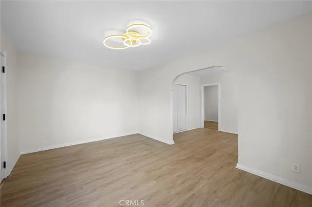 a view of a kitchen with wooden floor