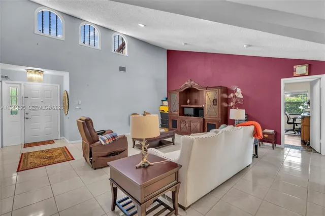 a living room with furniture and a table