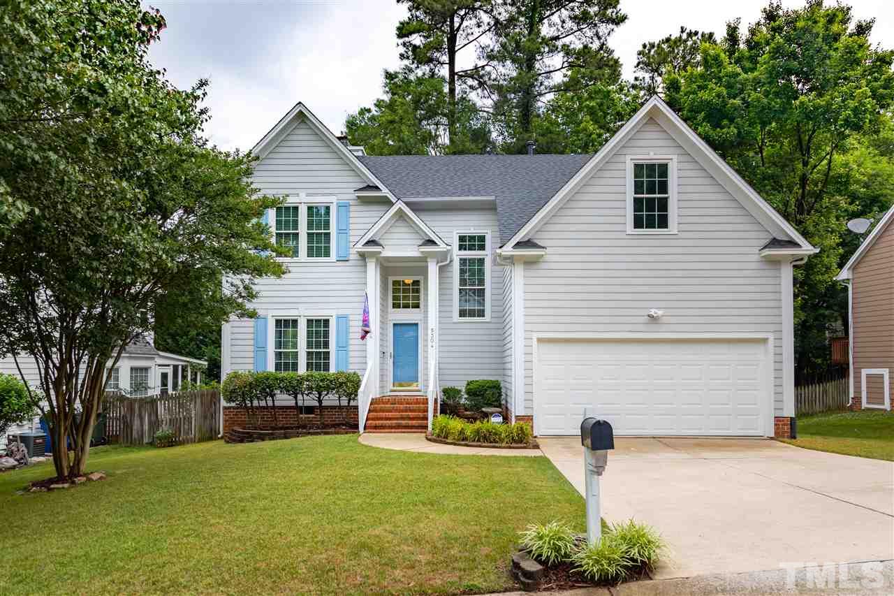 5304 Denmead Way Raleigh, NC 27613 - Photo 1 of 19 a view of a house with a yard and plants