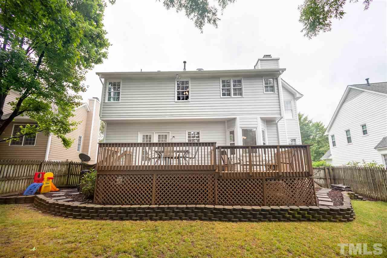 5304 Denmead Way Raleigh, NC 27613 - Photo 2 of 19 a view of a house with a balcony and trees