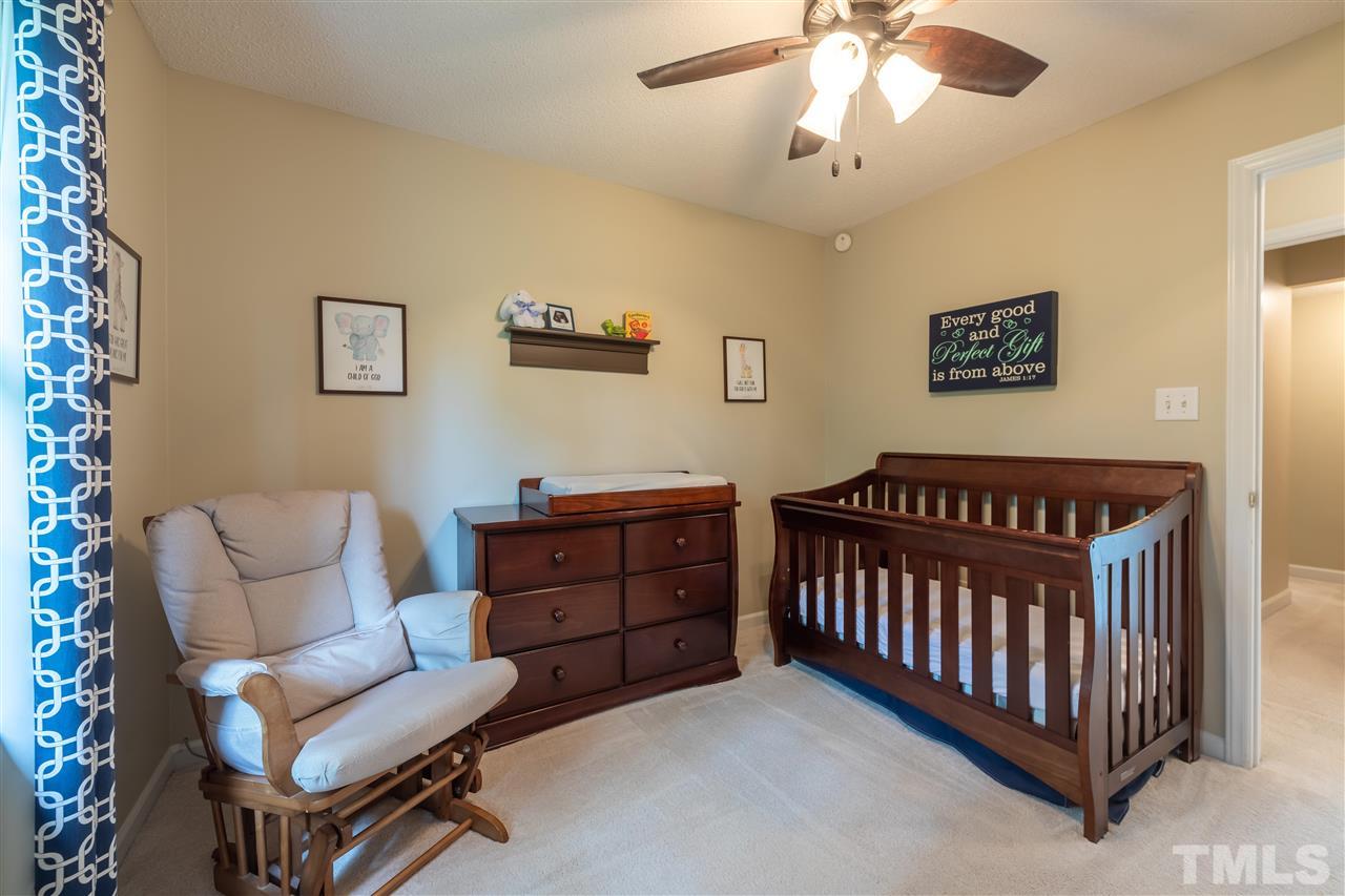 5304 Denmead Way Raleigh, NC 27613 - Photo 13 of 19 a bedroom with furniture and a window