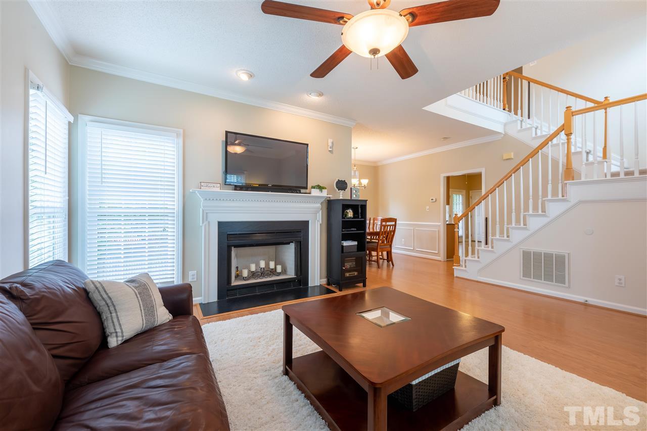 5304 Denmead Way Raleigh, NC 27613 - Photo 5 of 19 a living room with furniture and a fireplace