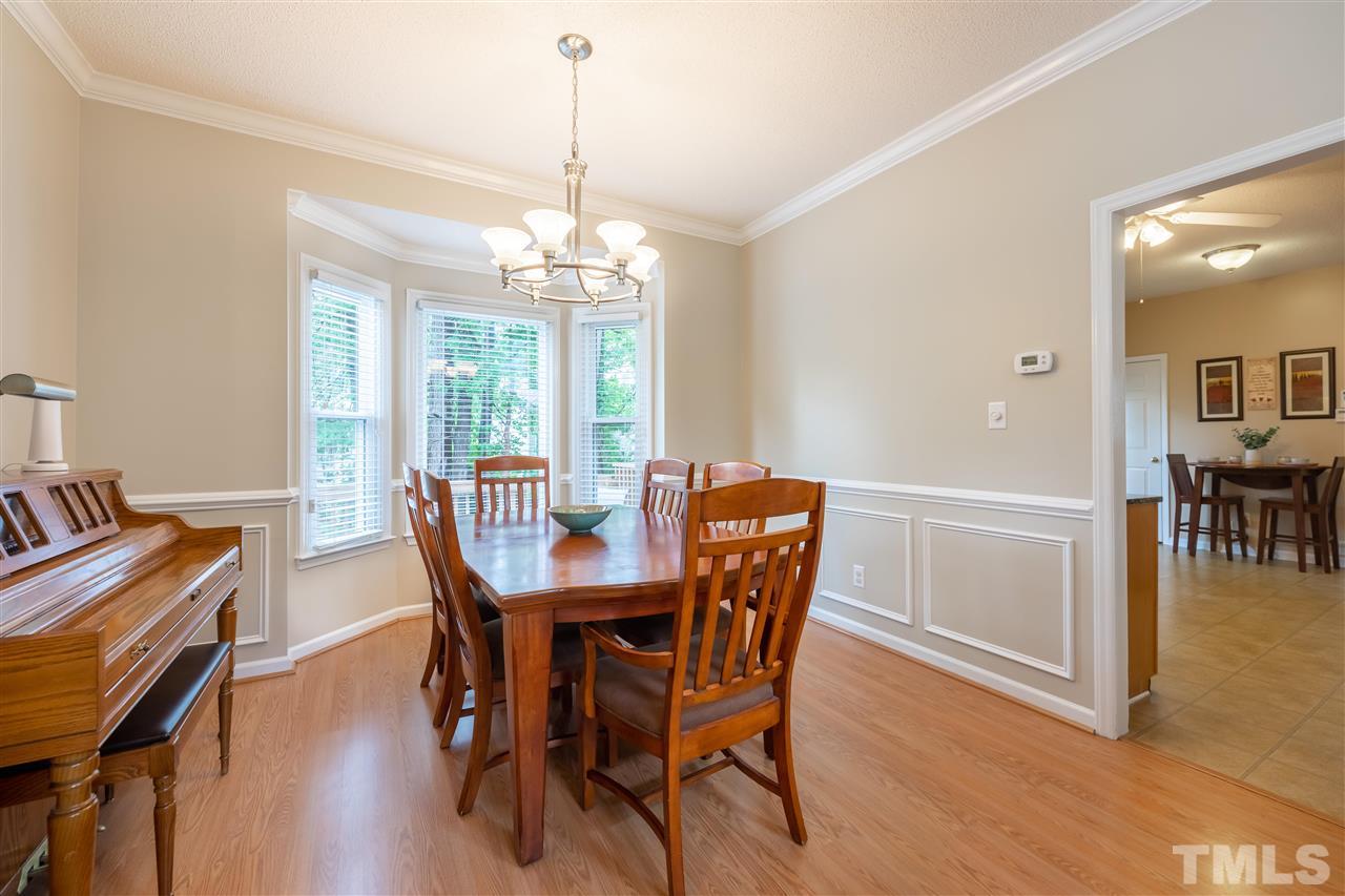 5304 Denmead Way Raleigh, NC 27613 - Photo 6 of 19 a view of a dining room with furniture window and wooden floor