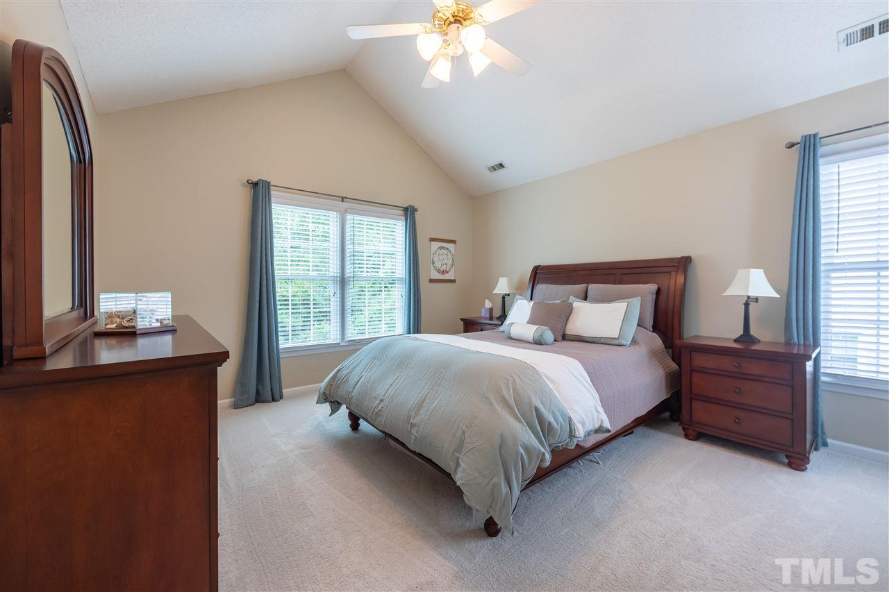 5304 Denmead Way Raleigh, NC 27613 - Photo 10 of 19 a bedroom with a bed and window