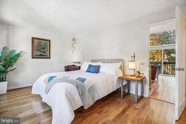 a view of a patio with table and chairs and potted plants
