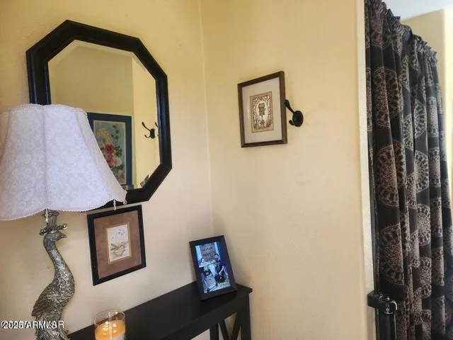 a picture of a wall with a mirror and a table