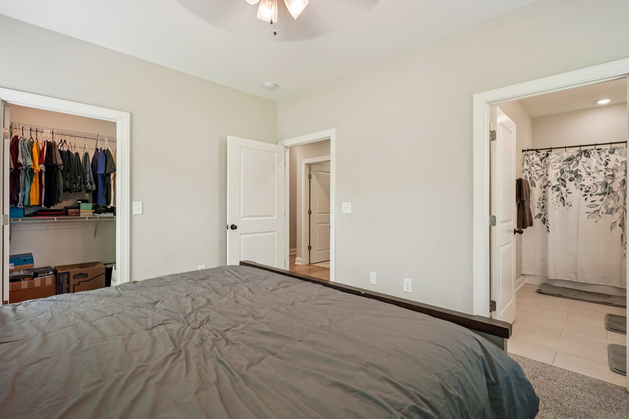 258 Woodruff Road Adams, TN 37010 - Photo 25 of 49 a bedroom with a bed and a view of bathroom