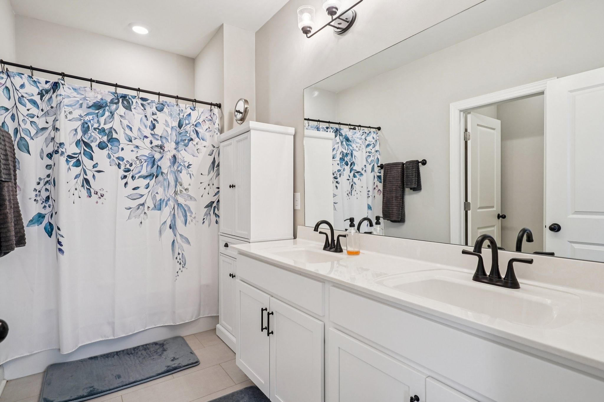 258 Woodruff Road Adams, TN 37010 - Photo 26 of 49 a bathroom with a sink and a mirror