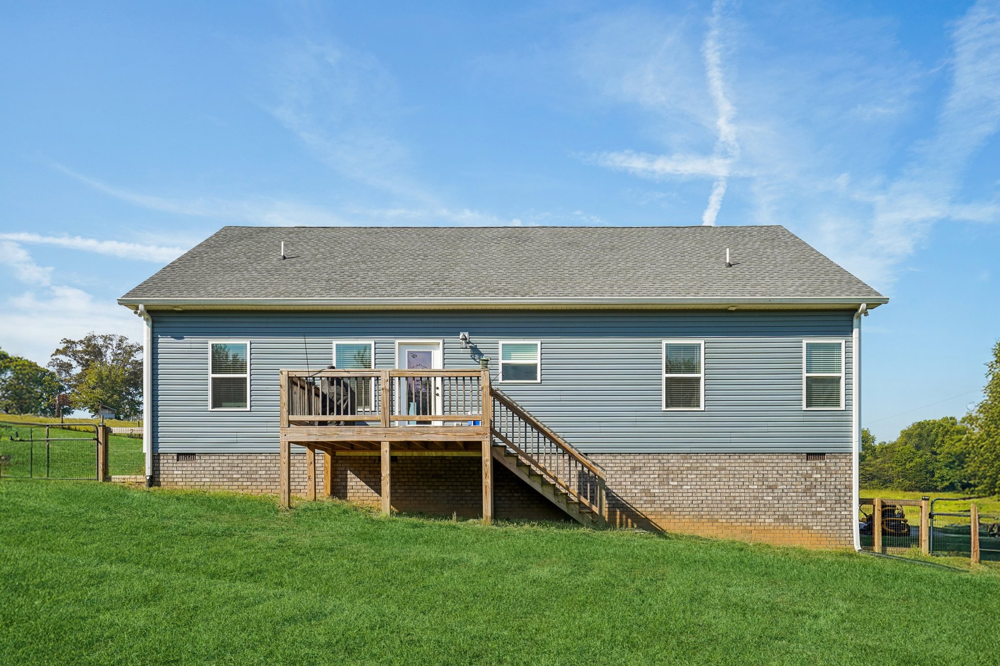 258 Woodruff Road Adams, TN 37010 - Photo 33 of 49 a front view of a house with a garden