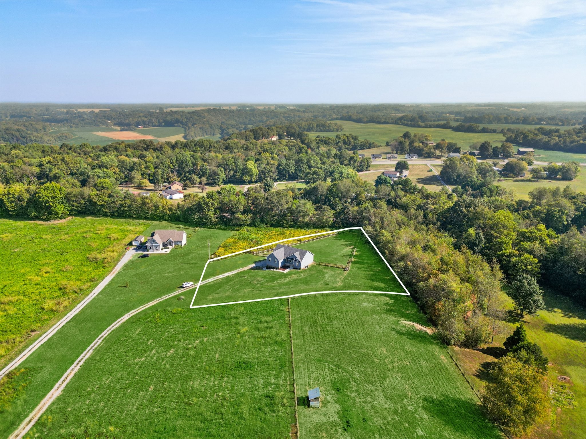 258 Woodruff Road Adams, TN 37010 - Photo 42 of 49 an aerial view of a tennis court