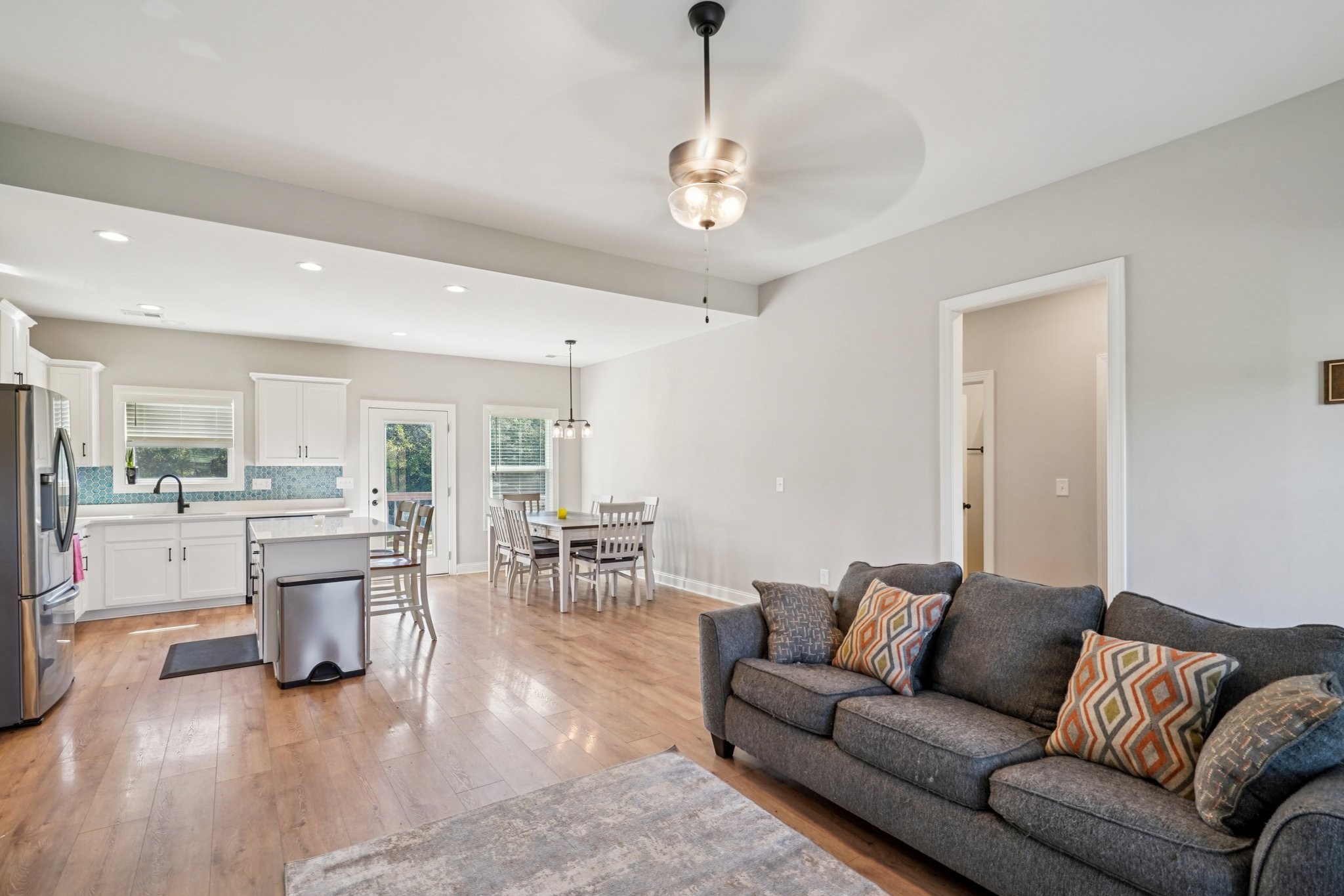 258 Woodruff Road Adams, TN 37010 - Photo 5 of 49 a living room with furniture and view of kitchen