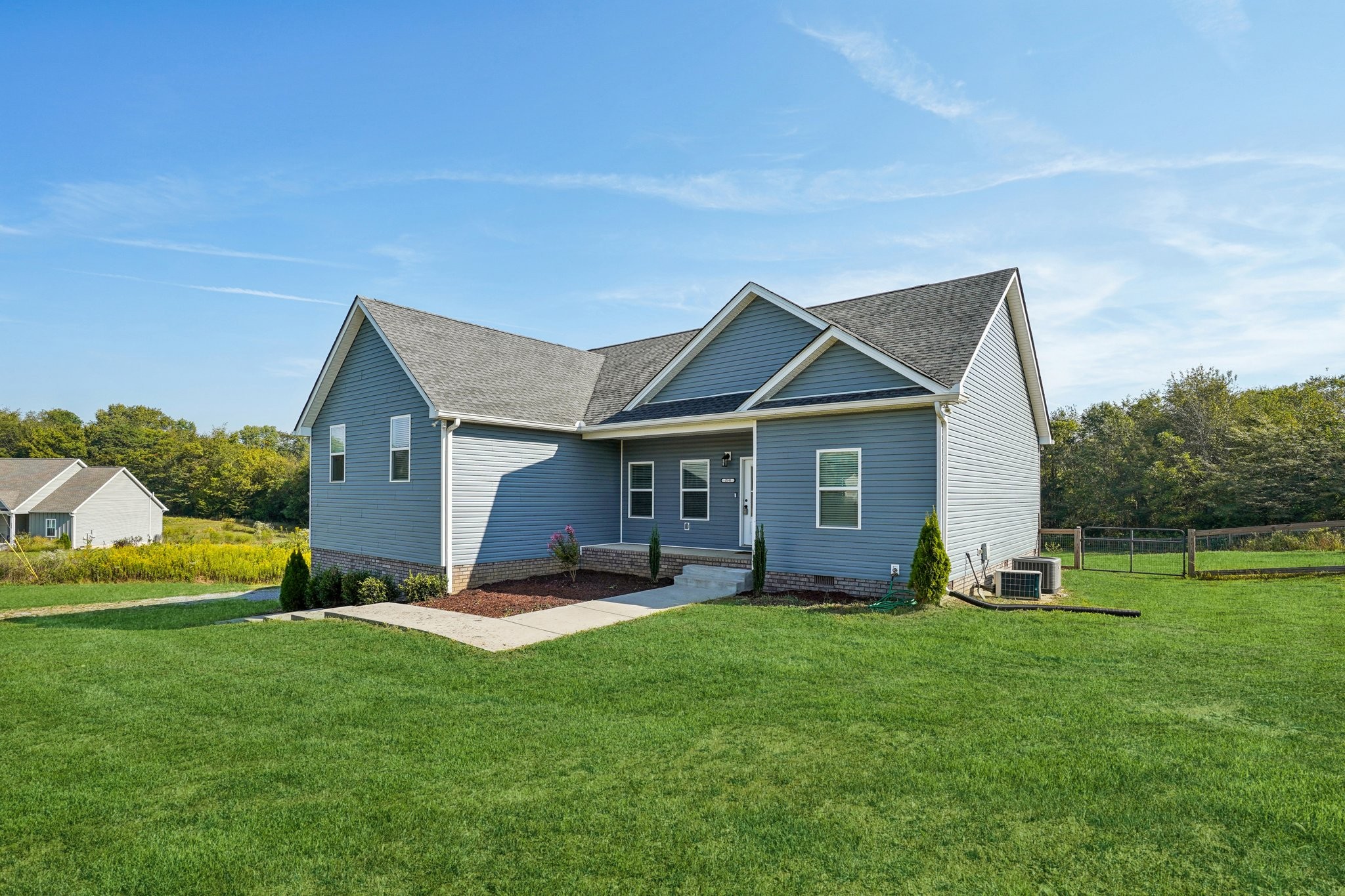 258 Woodruff Road Adams, TN 37010 - Photo 7 of 49 a view of a house with backyard