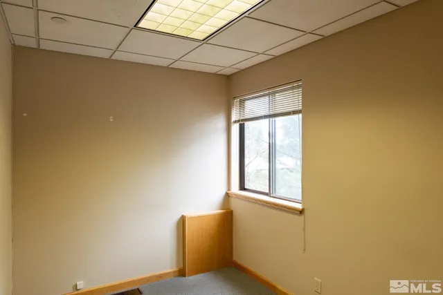 a view of empty room with windows