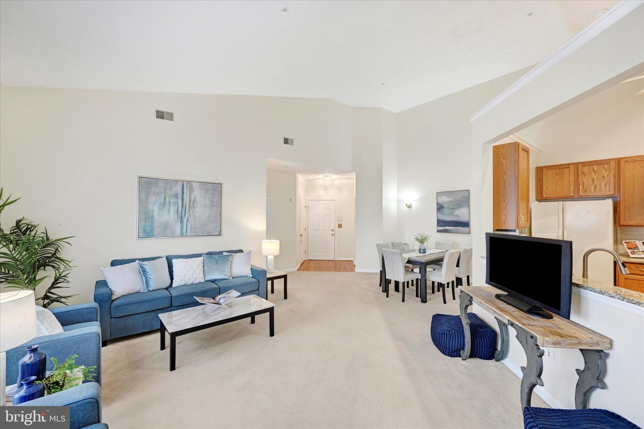 9606 Haven Farm Road, Unit 9606M Perry Hall, MD 21128 - Photo 11 of 49 a living room with furniture and a flat screen tv