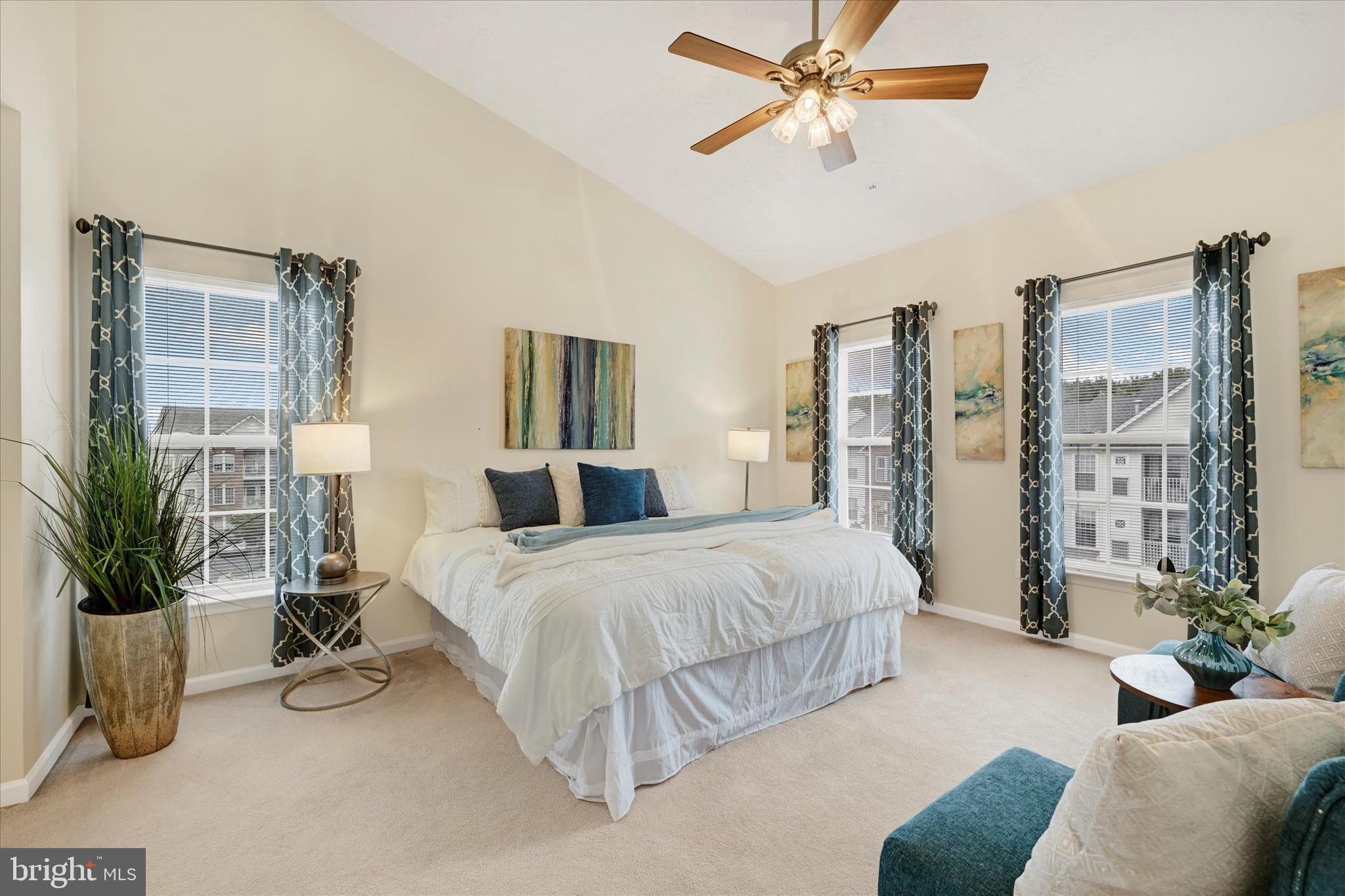 9606 Haven Farm Road, Unit 9606M Perry Hall, MD 21128 - Photo 21 of 49 a bedroom with a balcony a bed and a chandelier