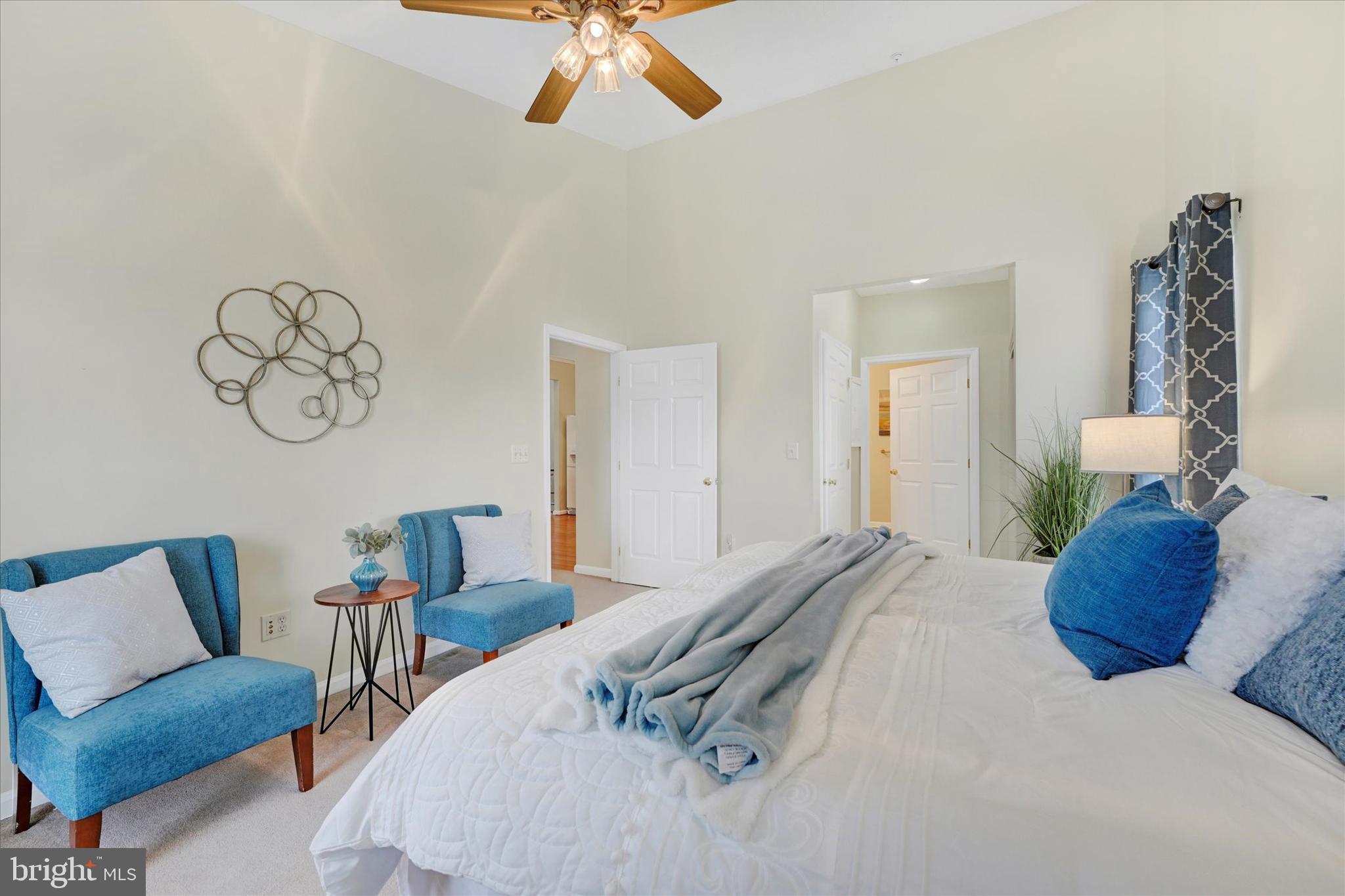 9606 Haven Farm Road, Unit 9606M Perry Hall, MD 21128 - Photo 22 of 49 a bedroom with a bed and a chandelier