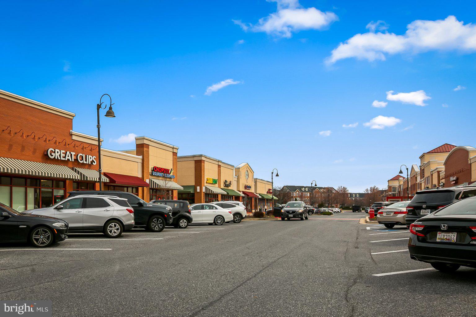 9606 Haven Farm Road, Unit 9606M Perry Hall, MD 21128 - Photo 45 of 49 a view of cars parked in front of a building