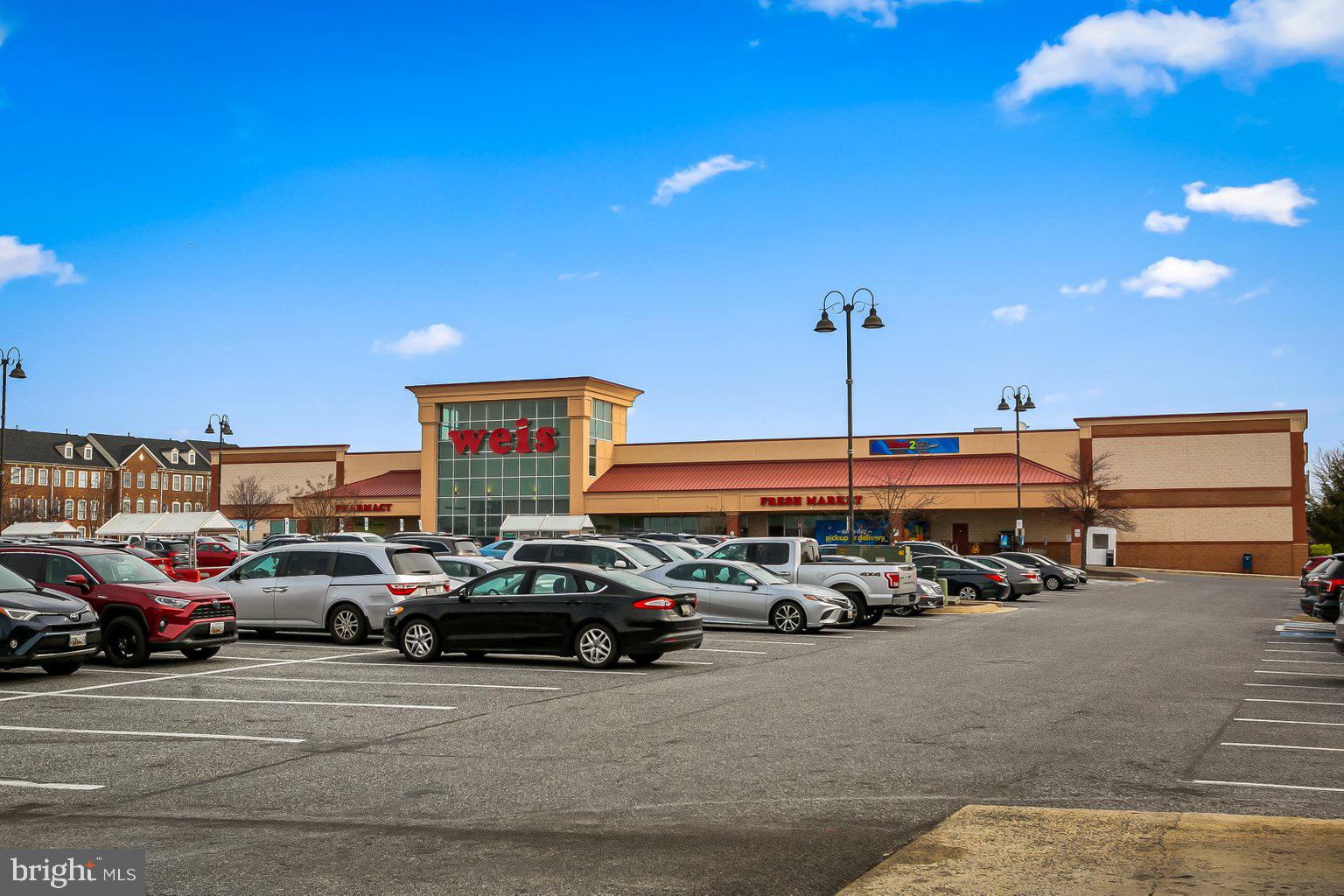 9606 Haven Farm Road, Unit 9606M Perry Hall, MD 21128 - Photo 46 of 49 a view of a cars park in front of a building