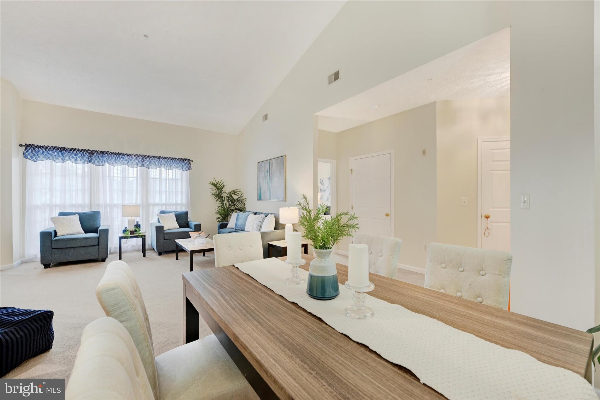 9606 Haven Farm Road, Unit 9606M Perry Hall, MD 21128 - Photo 8 of 49 a living room with furniture and a potted plant