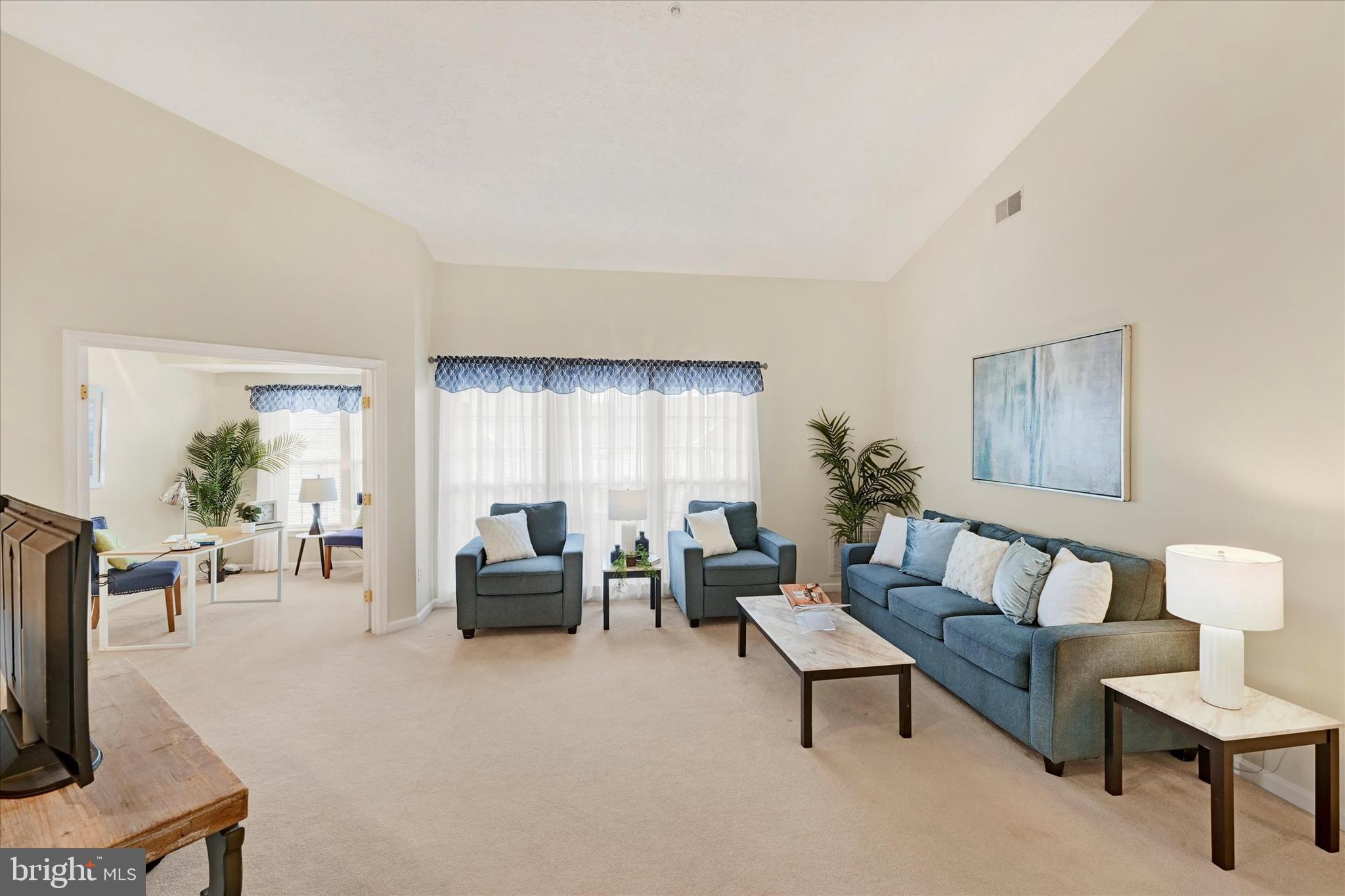 9606 Haven Farm Road, Unit 9606M Perry Hall, MD 21128 - Photo 10 of 49 a living room with furniture and a flat screen tv