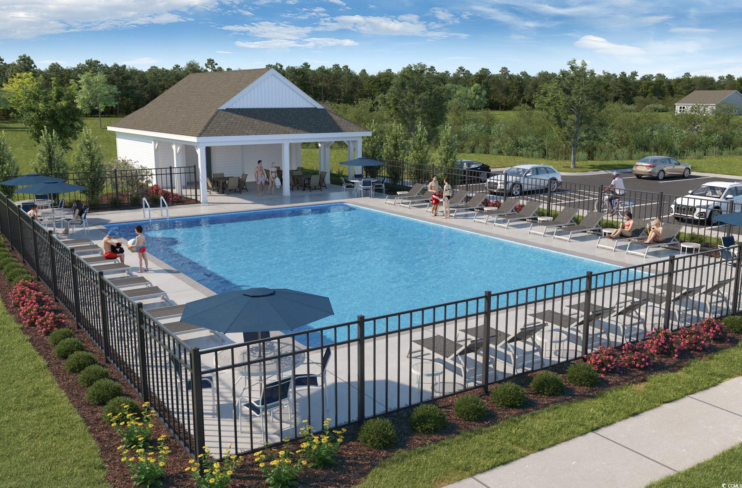 133 Buckingham Drive Loris, SC 29569 - Photo 17 of 17 Community pool featuring a patio and view of scattered trees