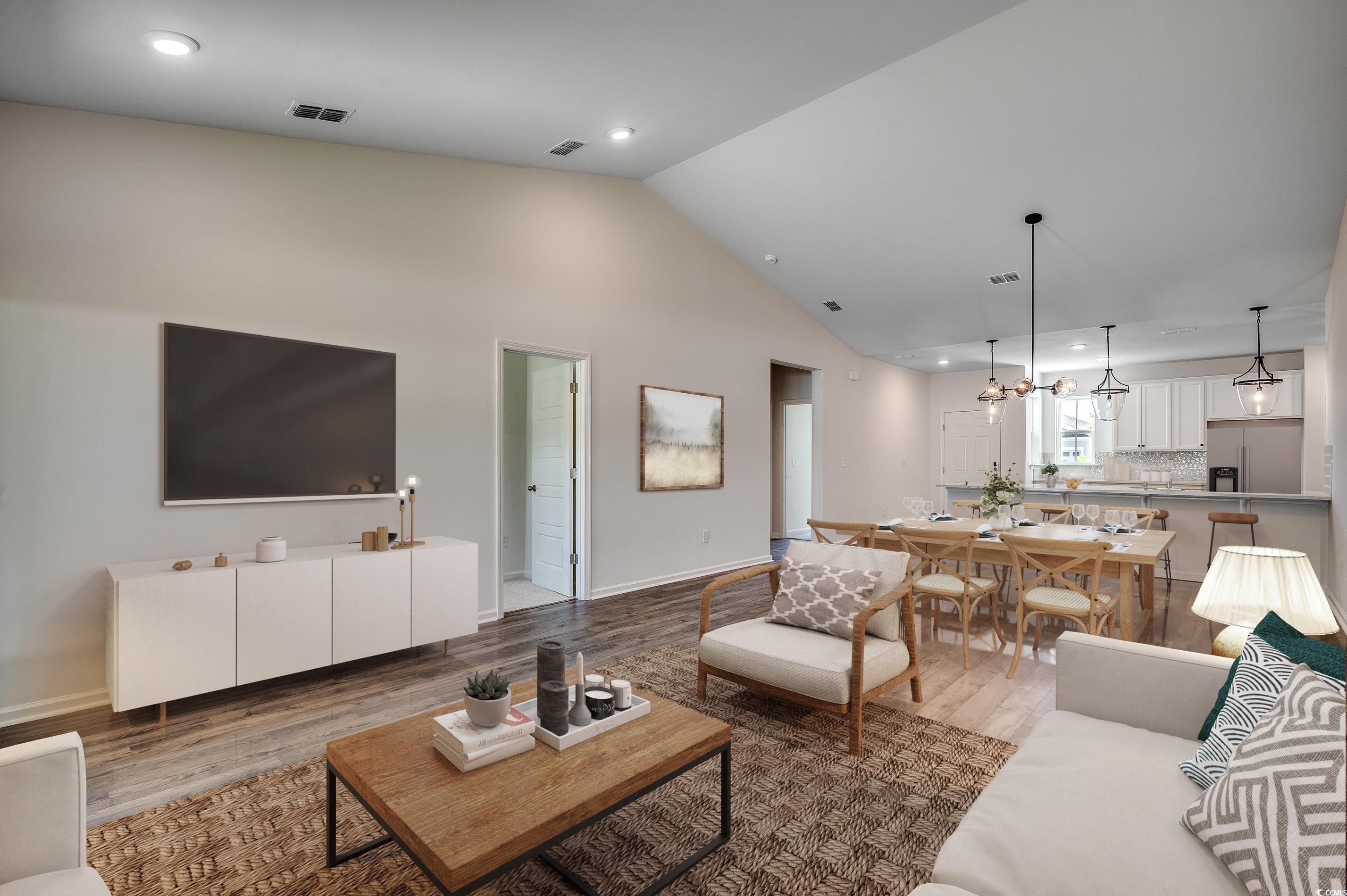133 Buckingham Drive Loris, SC 29569 - Photo 4 of 17 Living area featuring recessed lighting, wood finished floors, and high vaulted ceiling