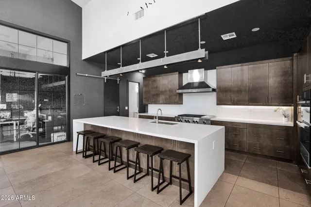 a kitchen with stainless steel appliances a sink and a refrigerator