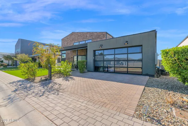 a view of a house with a yard and garage