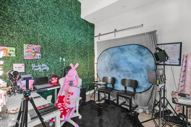 a bedroom with furniture and a fireplace