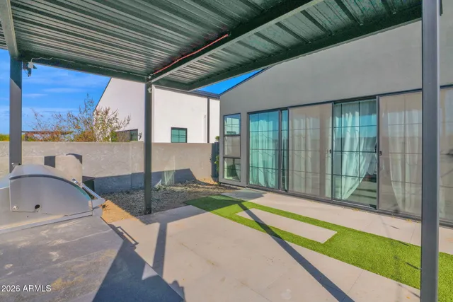 a view of a backyard with sitting area