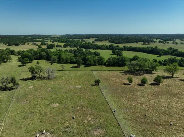 an aerial view of a houses with outdoor space