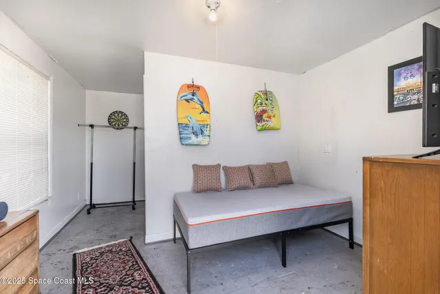 a bedroom with a bed and cupboard