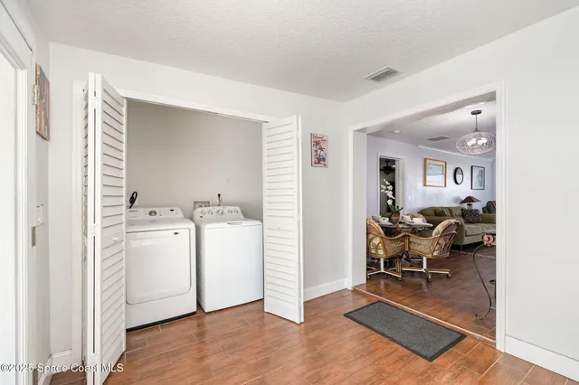 a living room with furniture and white walls